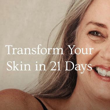 Woman with gray hair and a smile, with text overlay 'Transform Your Skin in 21 Days' on a beige background.