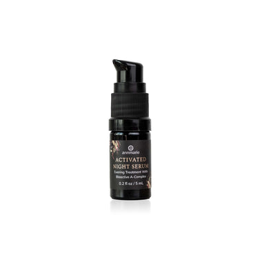 A small black pump bottle of Activated Night Serum with gold lettering, centered on a clean white background.