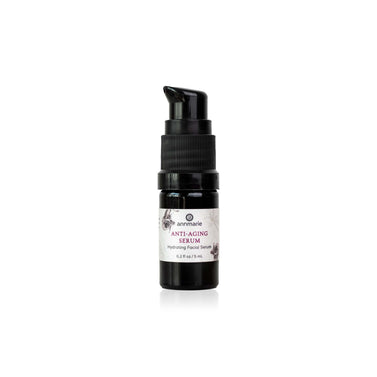 A small black pump bottle of Annmarie Anti-Aging Serum with a white label, centered on a plain white background.