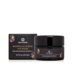 Anmarie Boswellia & Rose Eye Balm jar next to its black packaging box on a white background.