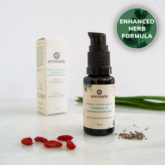 Herbal Facial Oil for normal and combination skin with enhanced herb formula, bottle with box and botanical ingredients.